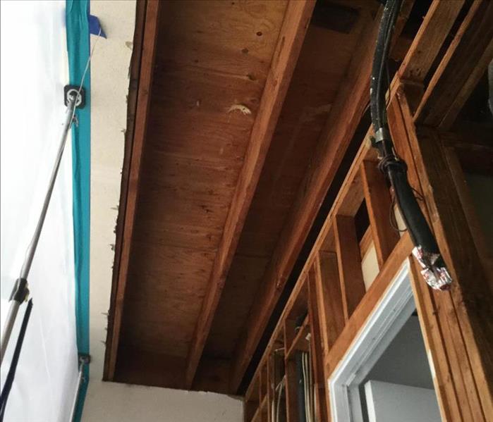 Exposed ceiling in home after a garage.