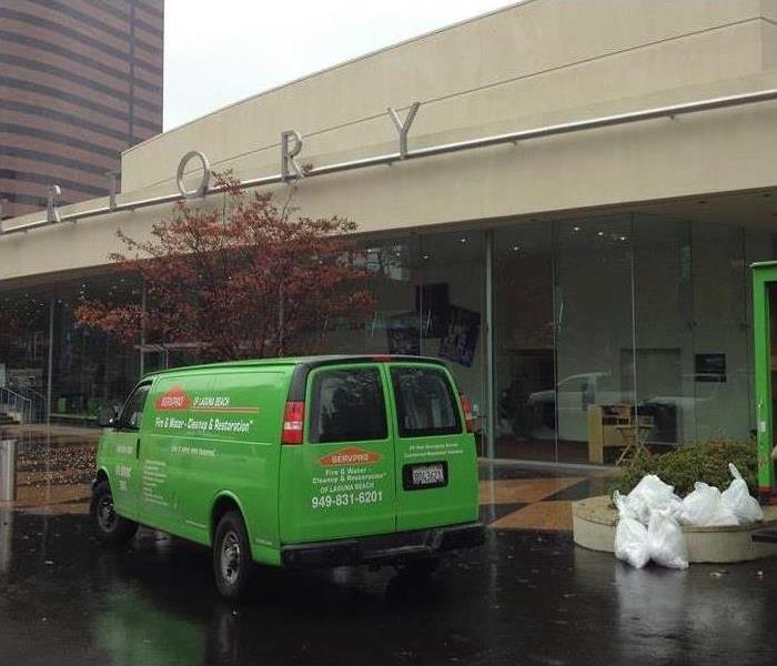 SERVPRO green vehicle parked outside a building